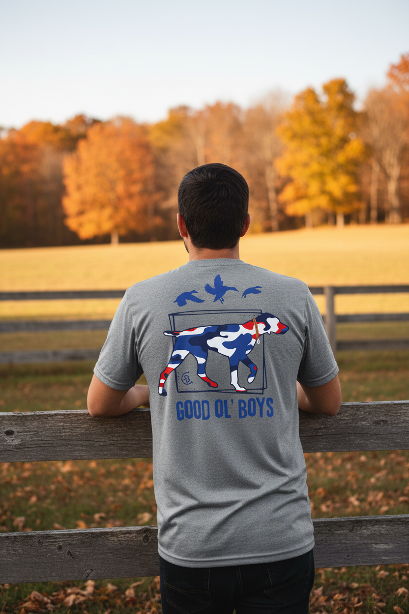 Good Ol' Boys graphic tee back view on athletic gray tee, red white and blue camo hunting dog design, rural fence setting - Country Boys Local
